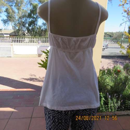 Must have size 44/20 white cotton strappy top.High quality from the USA. By BBC. As new.