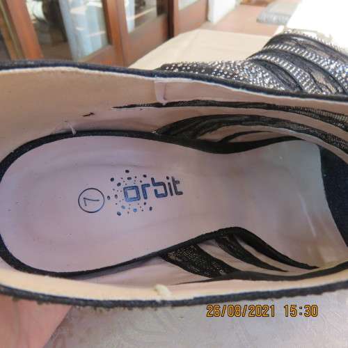 Pair of shiny black ankle summer boots with lace and studs. Stiletto heels.Open toes.By ORBIT size 7