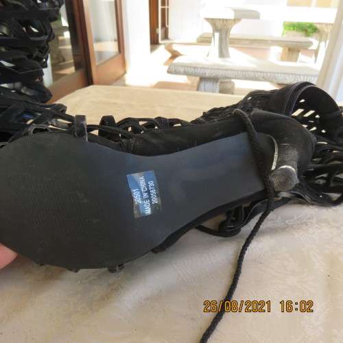 Knee length pair of black criss cross boots with long back zip. Size 7 by Legit.As new.Open toes.