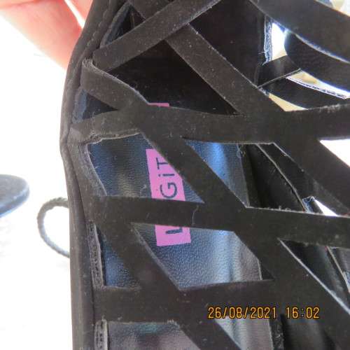 Knee length pair of black criss cross boots with long back zip. Size 7 by Legit.As new.Open toes.