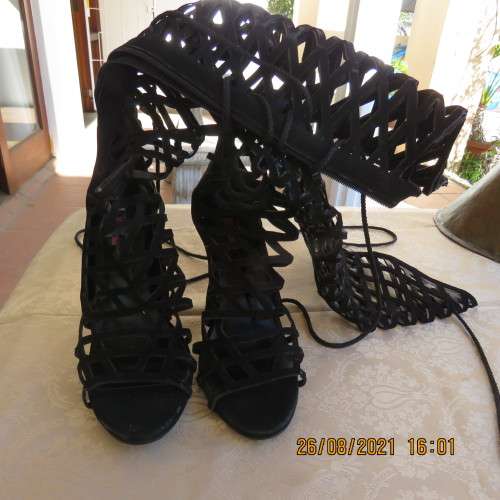 Knee length pair of black criss cross boots with long back zip. Size 7 by Legit.As new.Open toes.