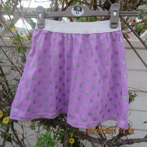 Cute little lilac skirt with wide silver elasticated waistband. By LOLLIPOP for girls 6-7 years old.