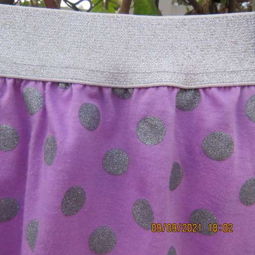 Cute little lilac skirt with wide silver elasticated waistband. By LOLLIPOP for girls 6-7 years old.
