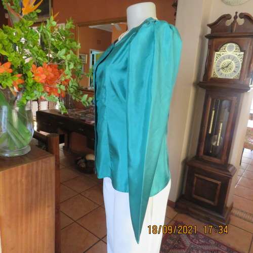 Haute Couture emerald green silk top by ADELE DALLAS ORR in size 36/12. As new.
