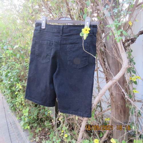 Boy`s black stretch knee length denim shorts. By RT for boy 13-14 years. Pockets back+front. As new.