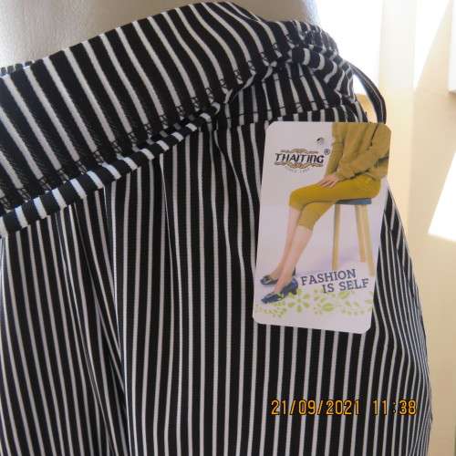 New black+white vertical striped straight legged cropped pants. Size 34/10 by THAITING from Thailand