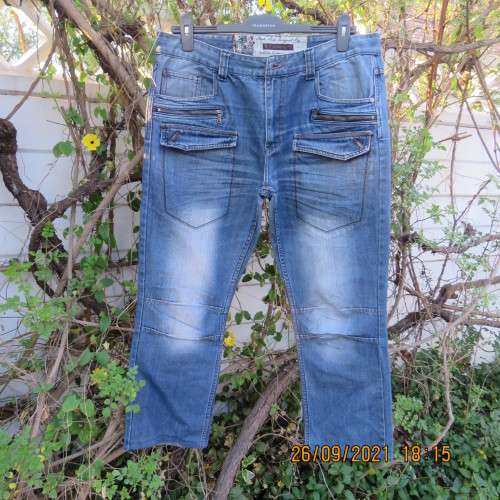 Fashion creative RT blue denim men`s jeans size 36 to 38.Two sets of pockets front.One set at back