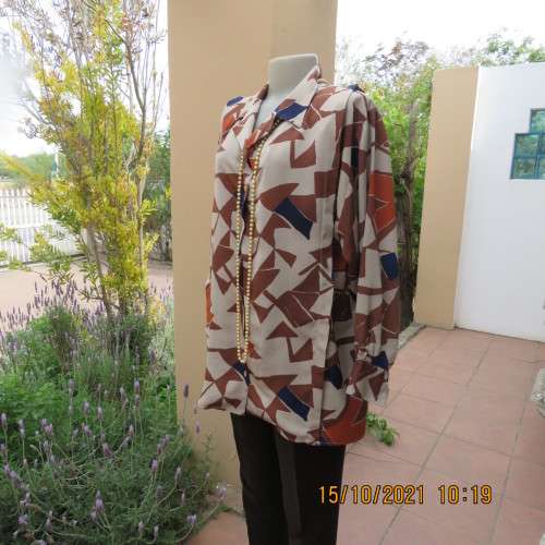 Geometric printed dark cream with navy,brick and brown patterns.Size 42/18.Button down.Good cond.