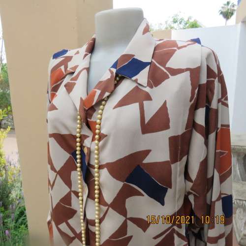 Geometric printed dark cream with navy,brick and brown patterns.Size 42/18.Button down.Good cond.