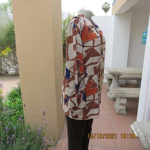 Geometric printed dark cream with navy,brick and brown patterns.Size 42/18.Button down.Good cond.