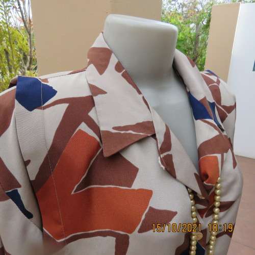 Geometric printed dark cream with navy,brick and brown patterns.Size 42/18.Button down.Good cond.