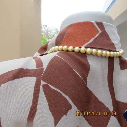 Geometric printed dark cream with navy,brick and brown patterns.Size 42/18.Button down.Good cond.