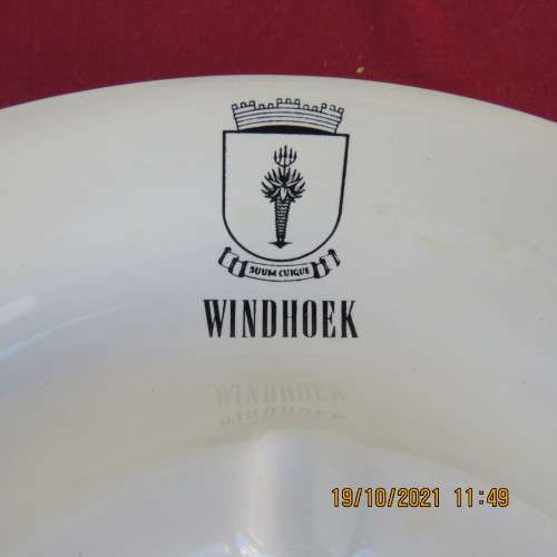 As new vintage large white porcelain ashtray from Windhoek S W A with badge.21cm diameter.About 30yr