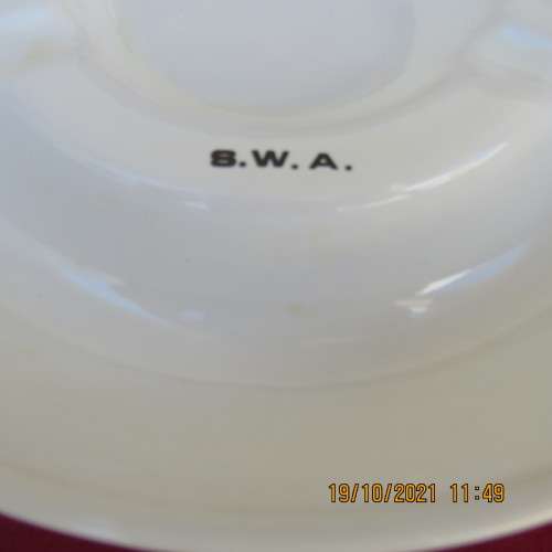 As new vintage large white porcelain ashtray from Windhoek S W A with badge.21cm diameter.About 30yr
