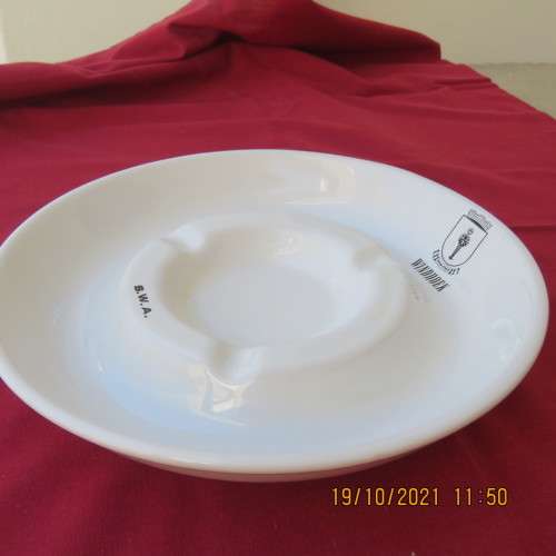 As new vintage large white porcelain ashtray from Windhoek S W A with badge.21cm diameter.About 30yr
