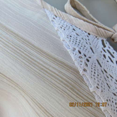 High quality slip over beige top by NEWS size 34/10 in diagonal stripes.In textured polyester/rayon