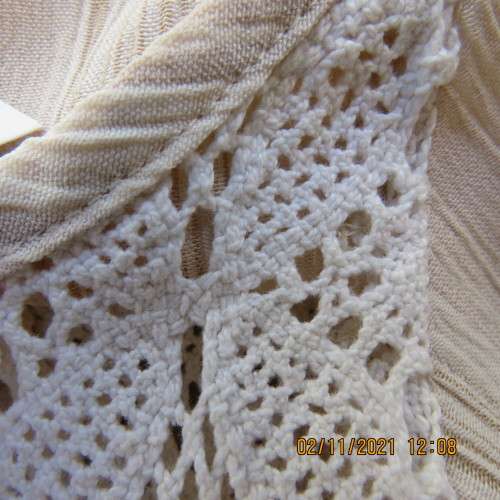 High quality slip over beige top by NEWS size 34/10 in diagonal stripes.In textured polyester/rayon