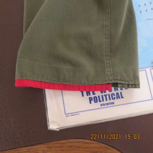 High quality dark olive green cropped pants with red edging size 36/12. In 100% cotton.As new.