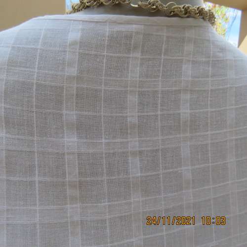 Cool white sleeveless cheese cloth top.Size 38/14.Close with buttons and loops.High side slits.