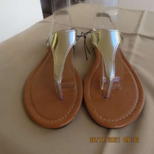 Pair of gold colour flat toe post sandals with straps at back. By IMAGE size 6. Never used.Brand new