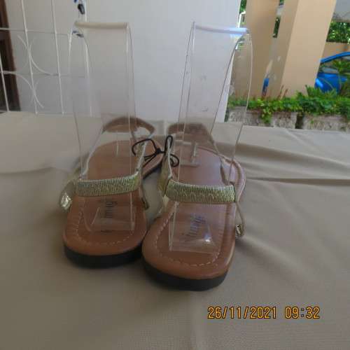 Pair of gold colour flat toe post sandals with straps at back. By IMAGE size 6. Never used.Brand new
