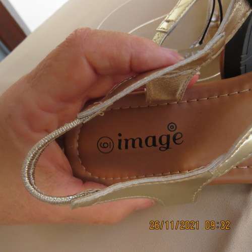 Pair of gold colour flat toe post sandals with straps at back. By IMAGE size 6. Never used.Brand new