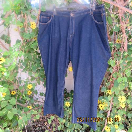 As new blue denim jeans by PENNY C in size 50/26. Tapered legs.Pockets back and front.
