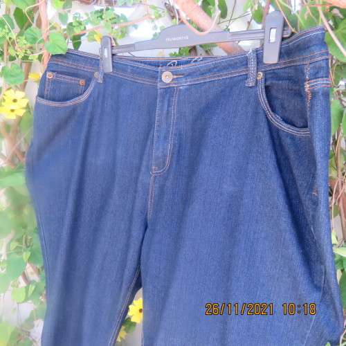 As new blue denim jeans by PENNY C in size 50/26. Tapered legs.Pockets back and front.