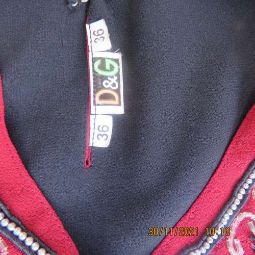 Glam richly embellished DOLCE and CABBANA ruby red sleeveless top size 36/12.Black underlay.As new