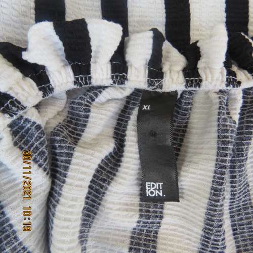 Get bonus fashion points in this black/white vertical striped off shoulder top.Size 44/46 by EDITION