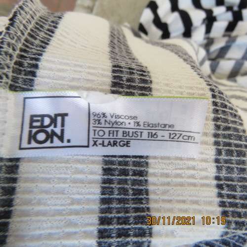 Get bonus fashion points in this black/white vertical striped off shoulder top.Size 44/46 by EDITION