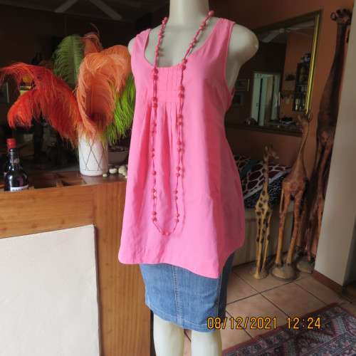 Cool coral pink sleeveless long maternity top by REAL CLOTHING size 36/12. Pleats on front.As new