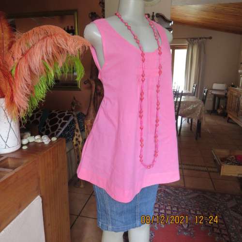 Cool coral pink sleeveless long maternity top by REAL CLOTHING size 36/12. Pleats on front.As new