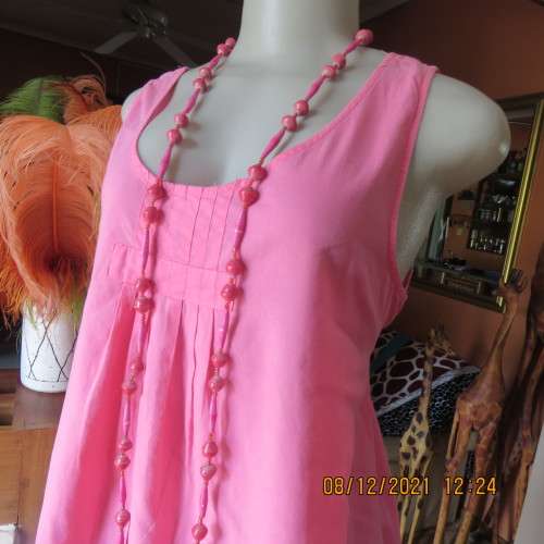 Cool coral pink sleeveless long maternity top by REAL CLOTHING size 36/12. Pleats on front.As new