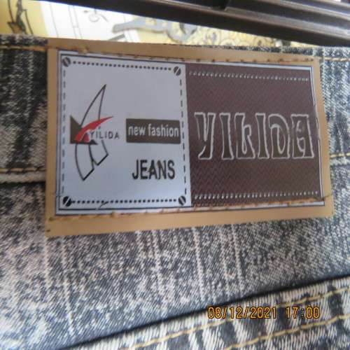 As new men`s straight leg cropped denim jeans size 34 by YILIDA. Washed out look.Logos.Pockets.