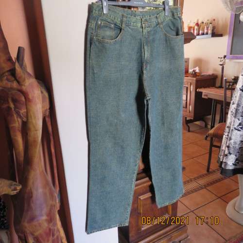 As new men`s straight legged denim jeans size 36 by JML. With lots of pockets.High waist,