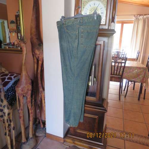As new men`s straight legged denim jeans size 36 by JML. With lots of pockets.High waist,