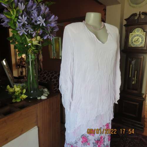 Stunning white double layer creased polyester asymmetrical top with elbow angel sleeves.Size 40/42.