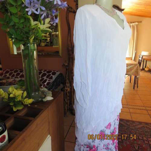 Stunning white double layer creased polyester asymmetrical top with elbow angel sleeves.Size 40/42.