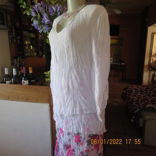 Stunning white double layer creased polyester asymmetrical top with elbow angel sleeves.Size 40/42.