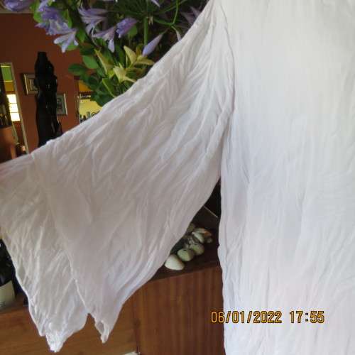 Stunning white double layer creased polyester asymmetrical top with elbow angel sleeves.Size 40/42.