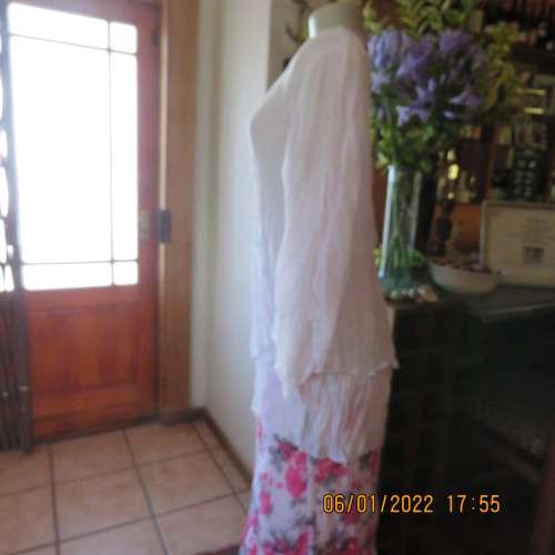 Stunning white double layer creased polyester asymmetrical top with elbow angel sleeves.Size 40/42.