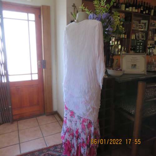 Stunning white double layer creased polyester asymmetrical top with elbow angel sleeves.Size 40/42.