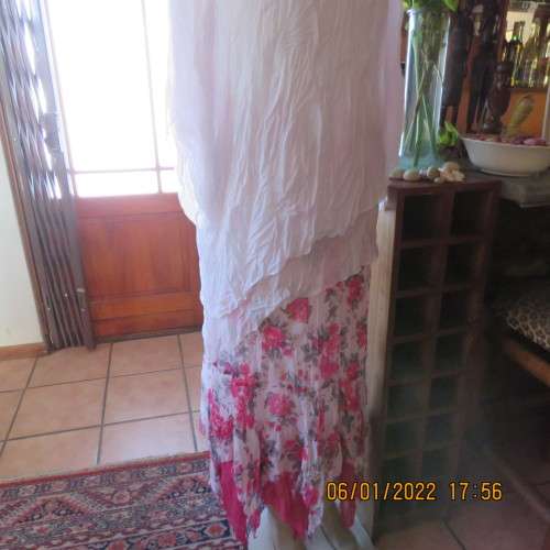 Stunning white double layer creased polyester asymmetrical top with elbow angel sleeves.Size 40/42.