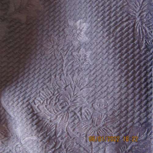 Very smart navy bodycon pencil skirt in stretch polyester with embossed flowers.Size 36/12.As new.