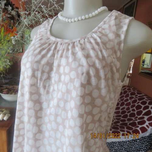 Cool ecru colour sleeveless top with white opaque dots.Size 32/8. Front cross overlay.As new