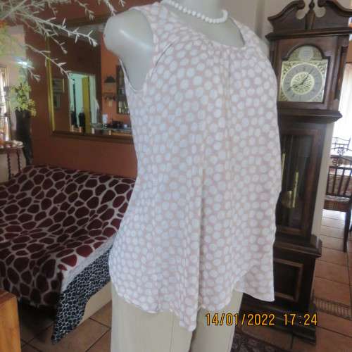 Cool ecru colour sleeveless top with white opaque dots.Size 32/8. Front cross overlay.As new