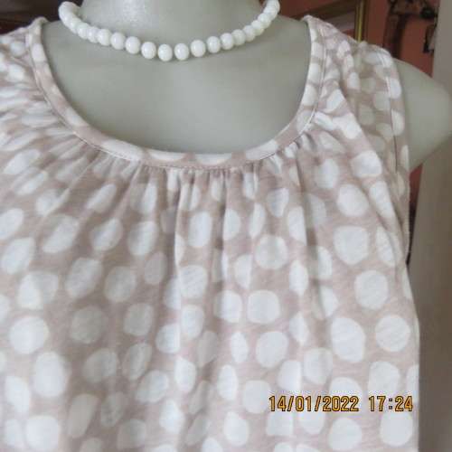 Cool ecru colour sleeveless top with white opaque dots.Size 32/8. Front cross overlay.As new