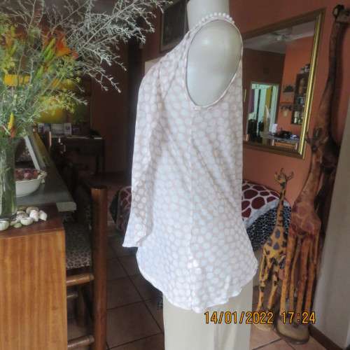 Cool ecru colour sleeveless top with white opaque dots.Size 32/8. Front cross overlay.As new