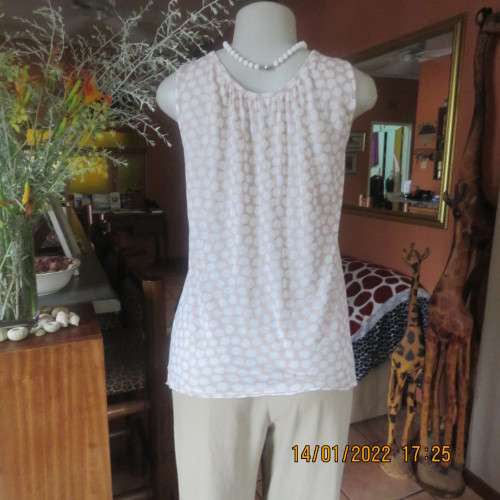 Cool ecru colour sleeveless top with white opaque dots.Size 32/8. Front cross overlay.As new